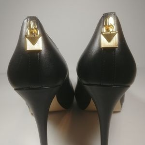 MK black leather pumps